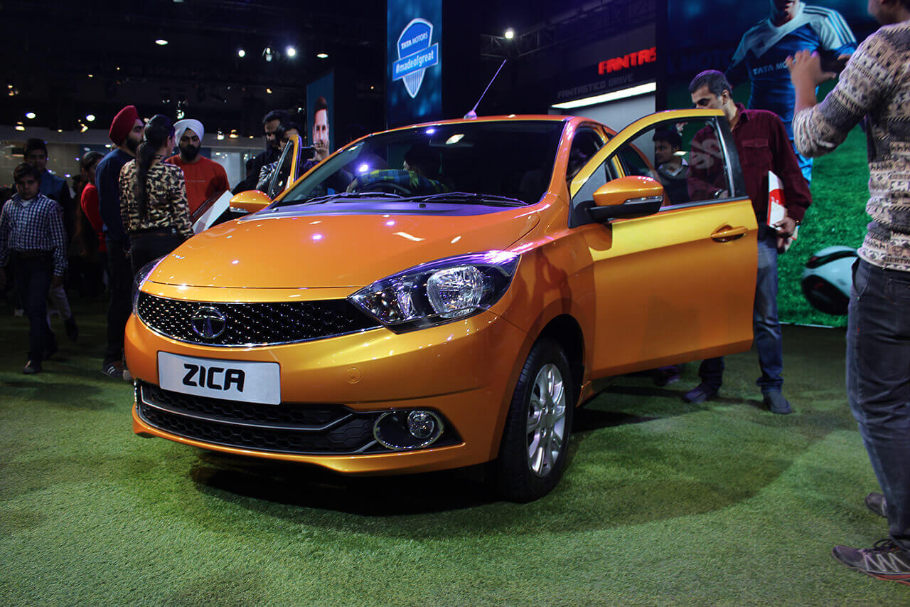 Tata Tiago Orange Exterior Auto Expo 2016 Spinny